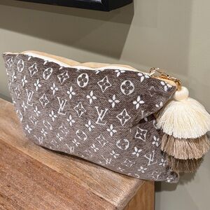 LV Zipper Pouch with tassel bag charm